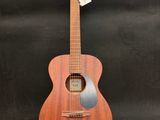 a wooden guitar on a stand with a tag on it