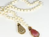 pearl necklace with a pink and gold tear pendant and a pearl necklace with a pink and gold tear pendant