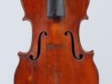 an old violin with a bow on a white background