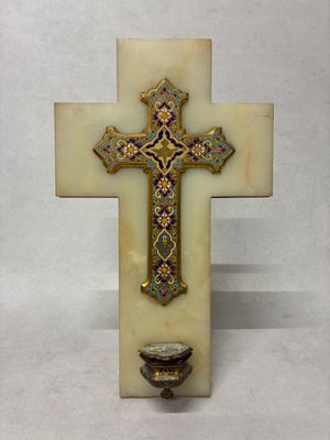 une image représentant une croix sur laquelle est posé un bougeoir