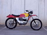 a red and yellow motorcycle parked in a parking lot