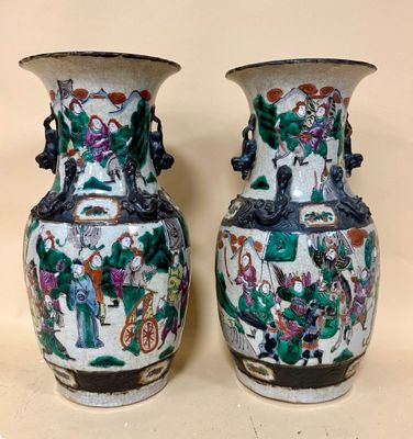two vases that are sitting on a table