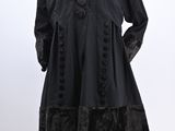 a woman ' s black coat on a mannequin mannequin mannequin mannequin mannequin mannequin mannequin mannequin