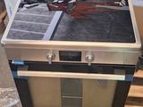 a stove that is sitting in the middle of a pallet