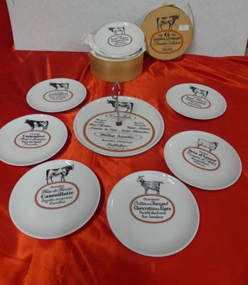 several plates with different types of food on them on a table