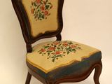 an image of a chair with a floral upholstered seat