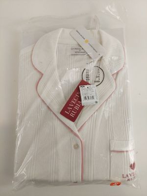 the white shirt is wrapped in plastic and ready to be worn