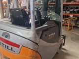a forklift that is parked in a warehouse