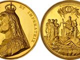 a close up of a gold coin with an image of a woman on it