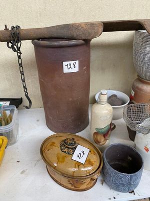 a table with a lot of pots and other items on it