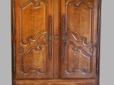 an old wooden armoire with carvings on the doors and drawers