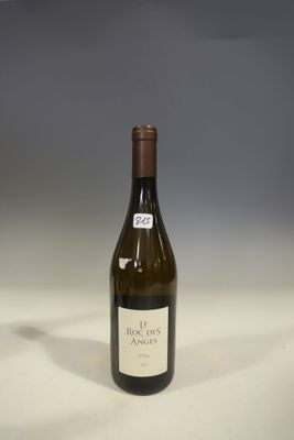 a bottle of wine that is sitting on a table
