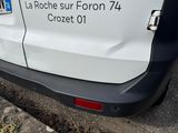 a white van that is parked on the side of the road