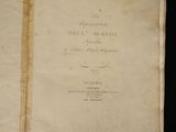 an old book with writing on it sitting on a table