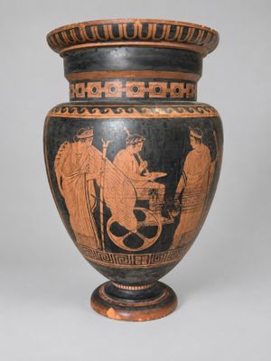 un vase sur lequel est représenté un homme et une femme