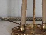 a lamp that is on a table with a clock on it