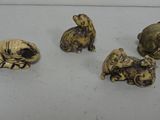 five different types of animal heads on a white surface