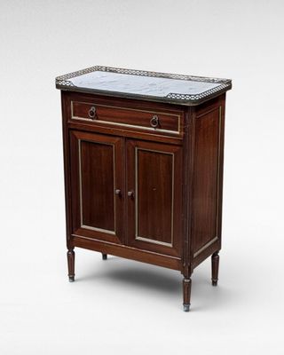 an image of a wooden cabinet with a marble top