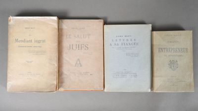 four books are lined up on a table with a gray background