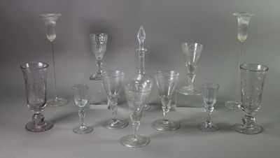 a lot of wine glasses that are sitting on a table