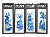 three framed blue and white pictures of vases and flowers