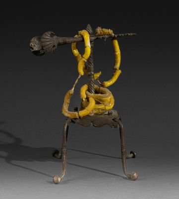 an image of a sculpture of a man holding a trumpet