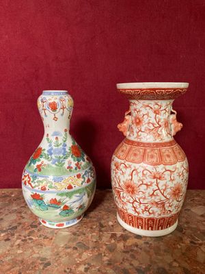 two vases sitting next to each other on a table