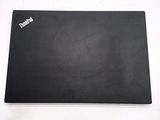 an image of a black mouse pad on a white surface