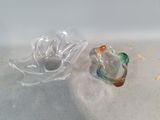 two pieces of glass sitting on a table