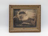 un tableau représentant un paysage, dans un cadre doré, accroché à un mur blanc