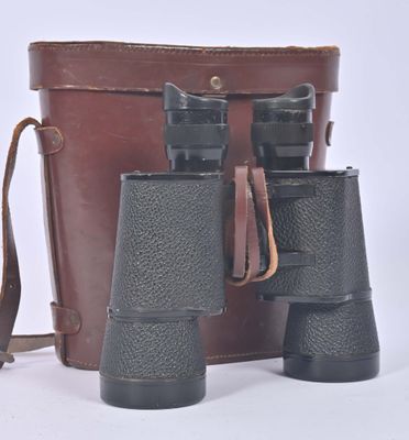 two binoculars sitting next to each other on a white surface