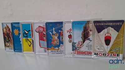 many cassettes that are lined up on a shelf