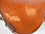 a close up of a violin that is sitting on a table