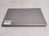 a laptop that is sitting on a white surface