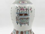 an image of a white and blue vase with a wooden base