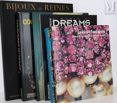 several books are stacked on top of each other on a table