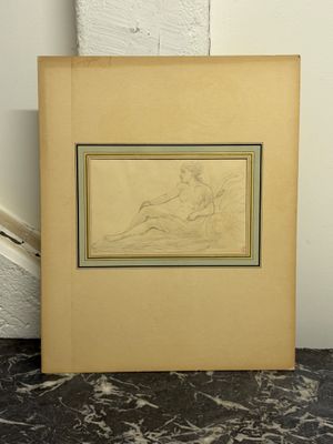 une vieille photo représentant le dessin d'une femme assise par terre