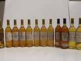 several bottles of wine are lined up on a table