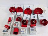 a lot of red and white tools that are on the table