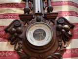 a clock that is on the wall on the bed