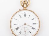 an antique pocket watch with roman numerals on the face