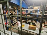 a room with a lot of shelves and a lot of boxes