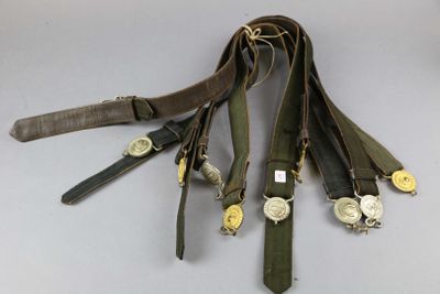 a lot of belts that are tied together on a table