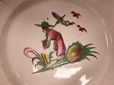 a plate with a picture of a man with a hat on it