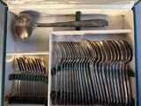 a lot of spoons and spoon spoons in a box
