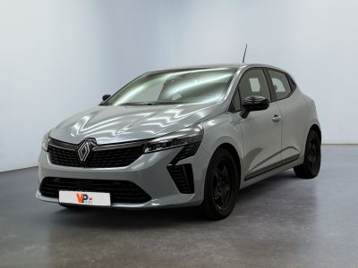 a silver car parked in a room with a white wall