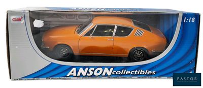 an orange toy car in a box on a white background