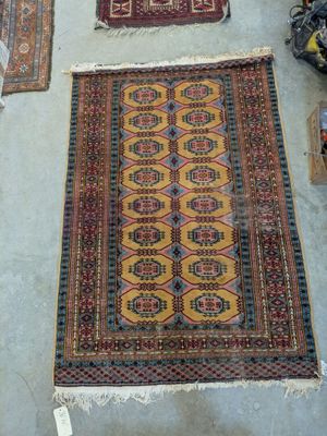 several rugs are laid out on the floor in a room