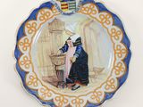 a plate with a picture of a woman on it