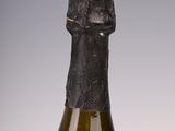 bottles of wine are lined up in a row on a table